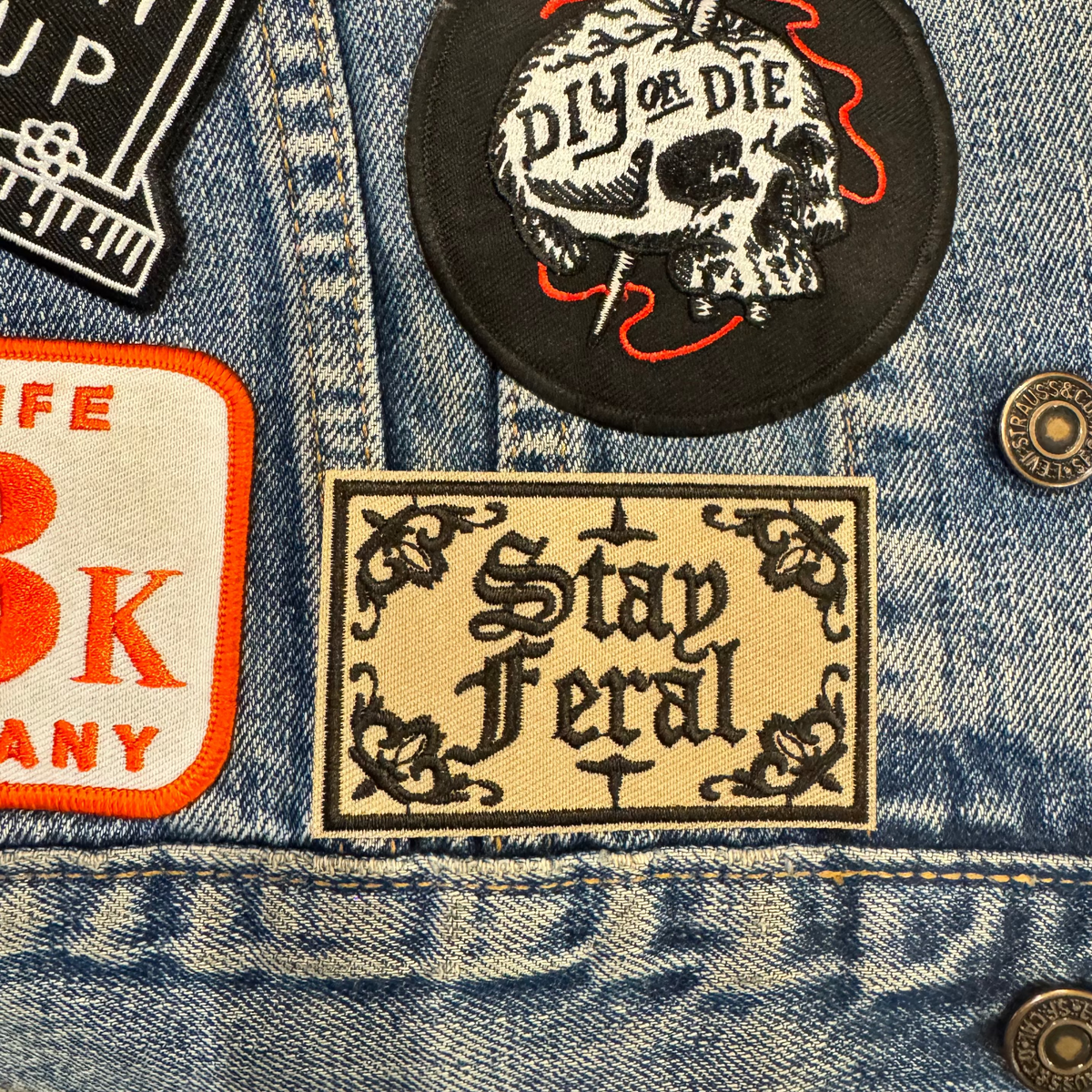 Stay feral embroidered patch in gothic font