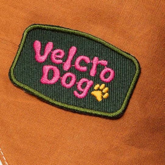 Velcro dog embroidered patch by Scouts Honour, merit badges for dogs. Dark green with pink writing , funny dog patch. 