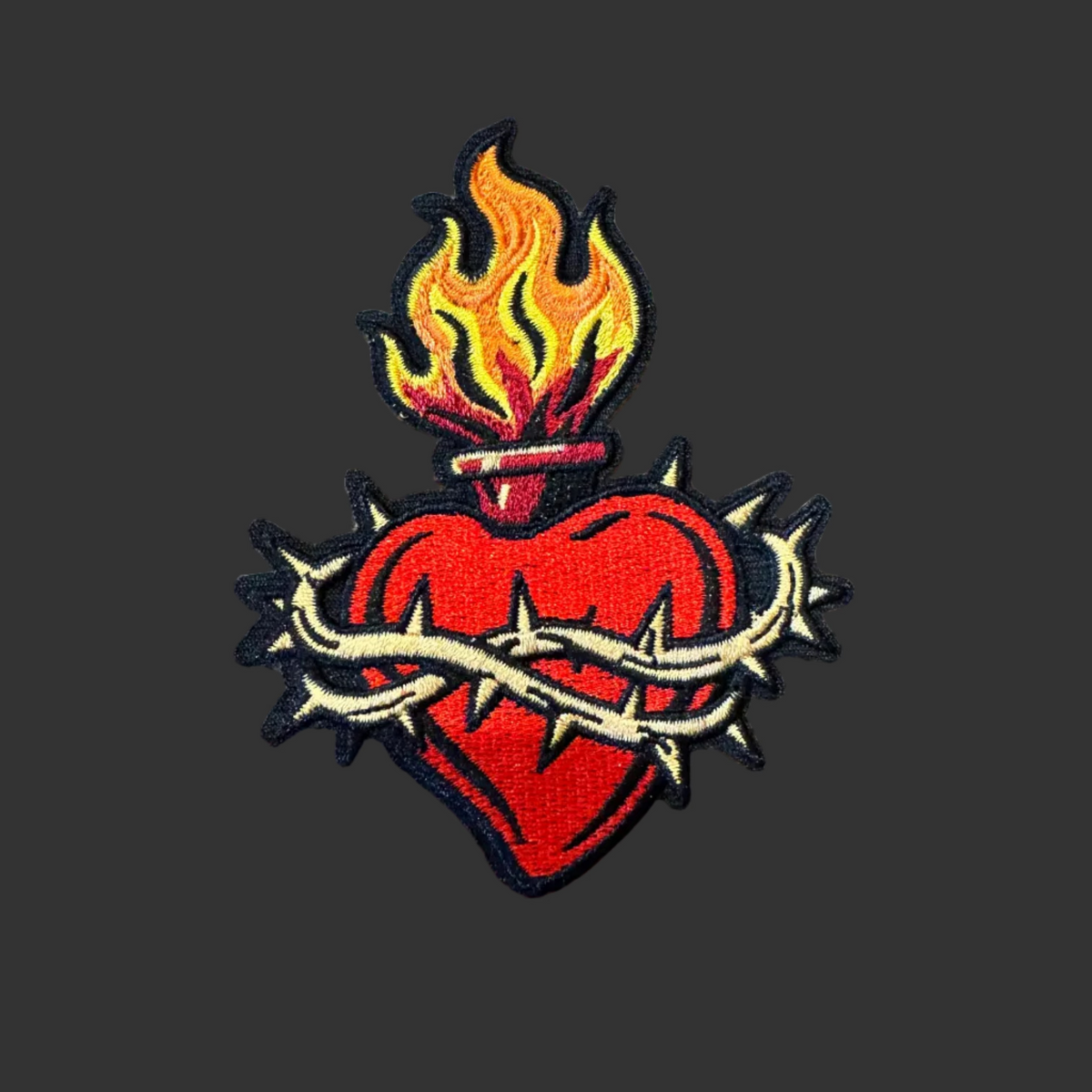 Heart wrapped in barbwire embroidered patch. 