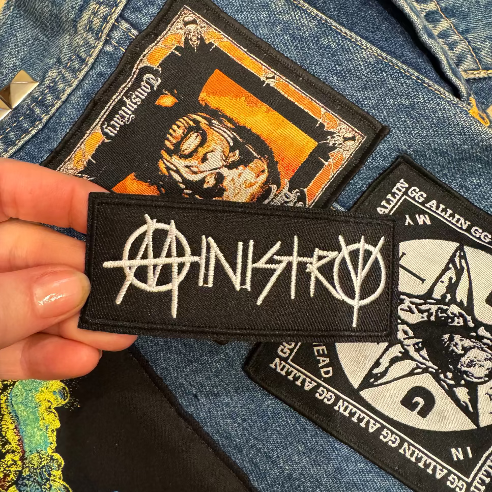 Ministry industrial metal band patch with battle vest background