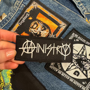 Ministry industrial metal band patch with battle vest background